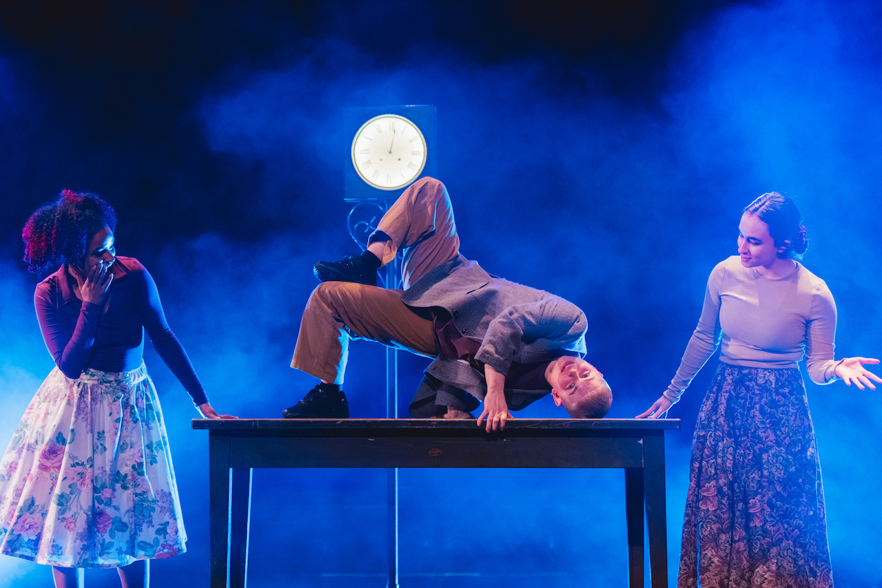 A person is breakdancing on a table